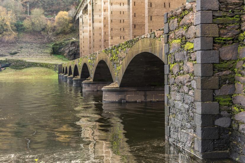 Roman bridge over the river Miño in Portomarin (rebuilt in the Middle Ages) and the Santiago's road (Lugo, Spain)