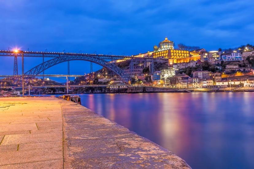 Scenic view of Porto at summer evening against dramatic sky