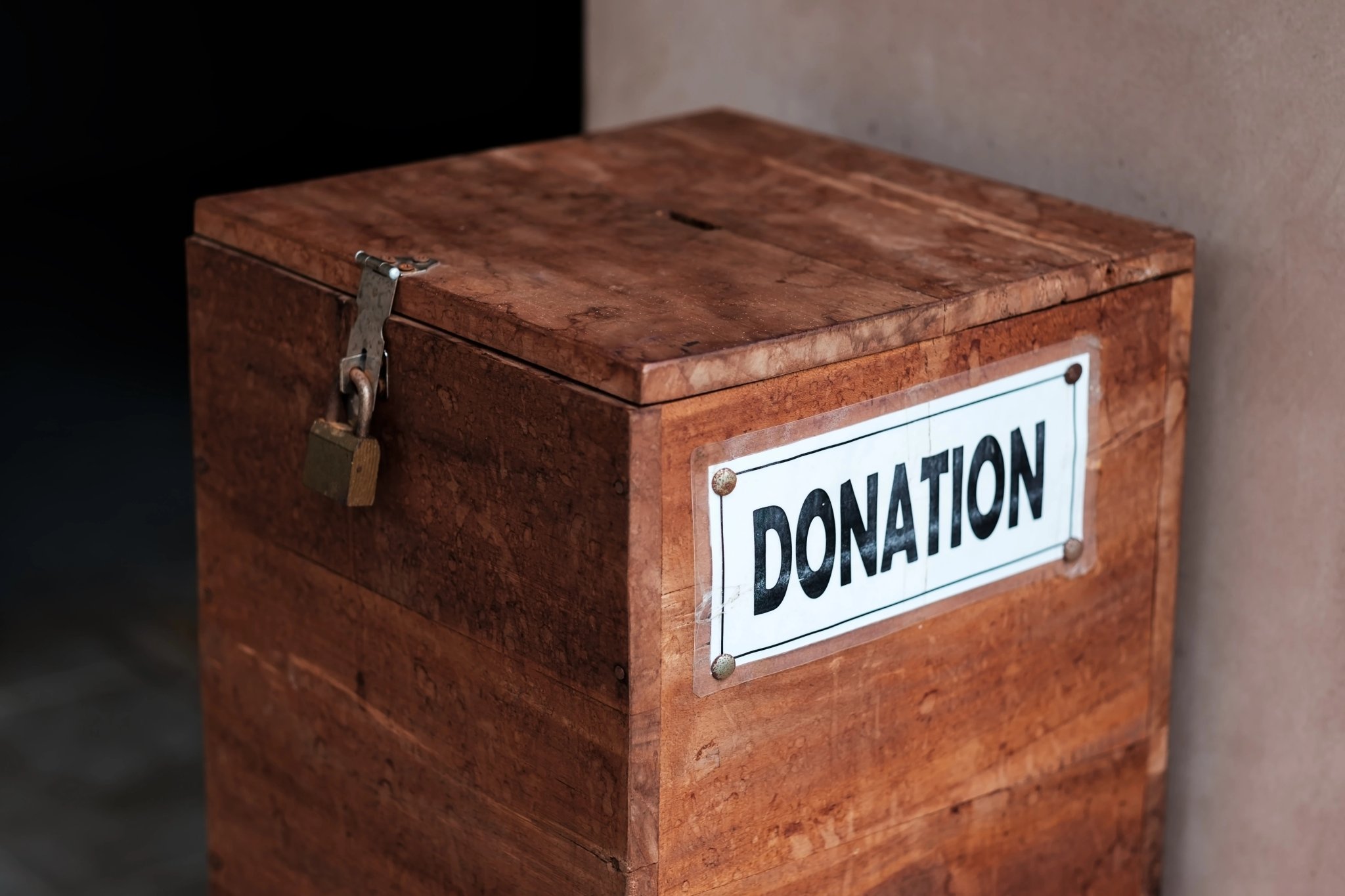 A box for donations in temple. Concept of positive social communication