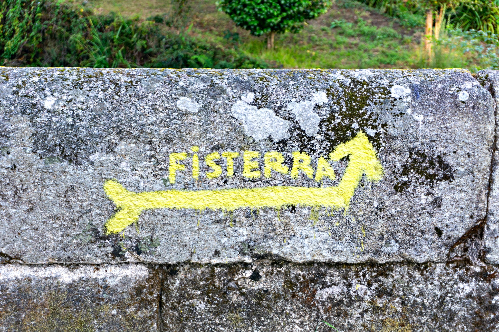 Sign and arrow of ancient pilgrim routes The Way of Saint James(El Camino de Santiago) to Fisterra.