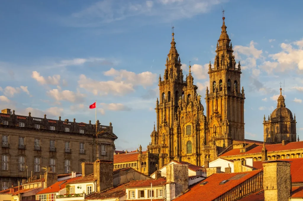 Santiago de Compostela Cathedral Towers Close Up with Sun Light Hitting the facade and Tiled Roofs La Coruña Galicia